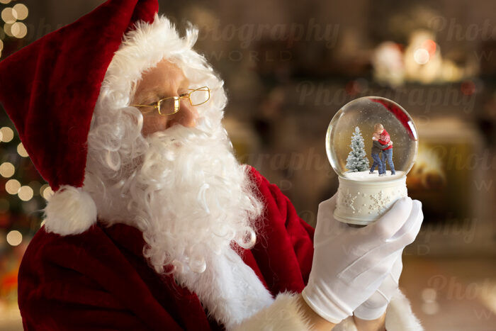 Santa Holding Snow Globe